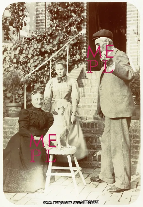 : Three people with a dog in a garden : Three people with a dog in a garden