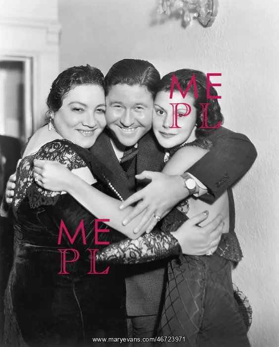 : Three people embracing and laughing : Three people embracing and laughing