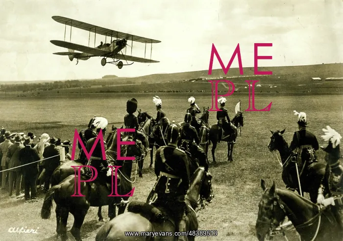 : People in a field looking up at a biplane : People in a field looking up at a biplane