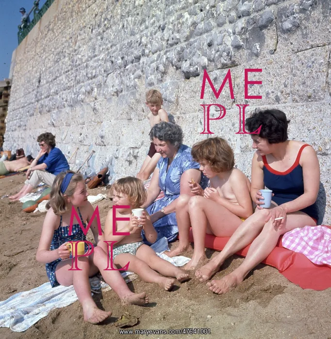  : People having a drink on a sandy beach