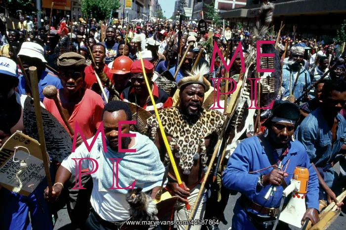 : People, mainly men, armed with traditional weapons : People, mainly men, armed with traditional weapons