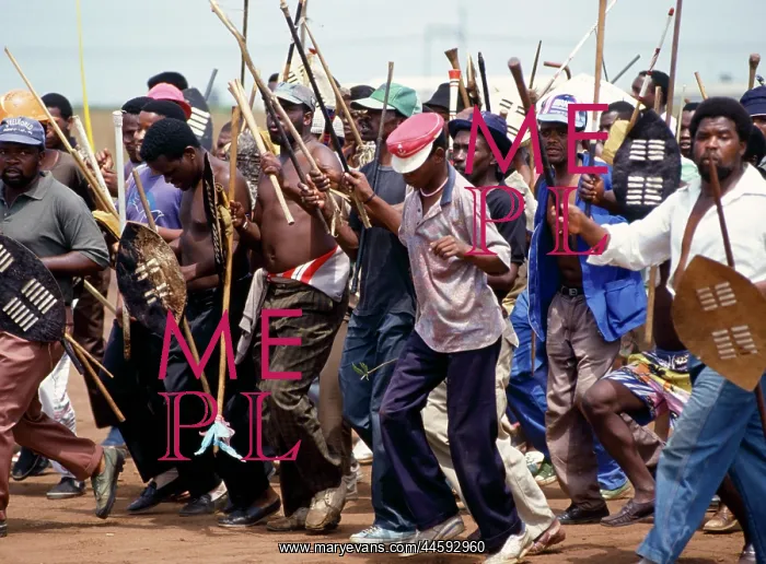 : People, mainly men, armed with traditional weapons : People, mainly men, armed with traditional weapons