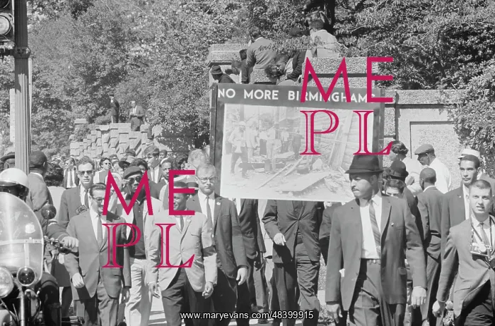  : People march in memory of Negro youngsters