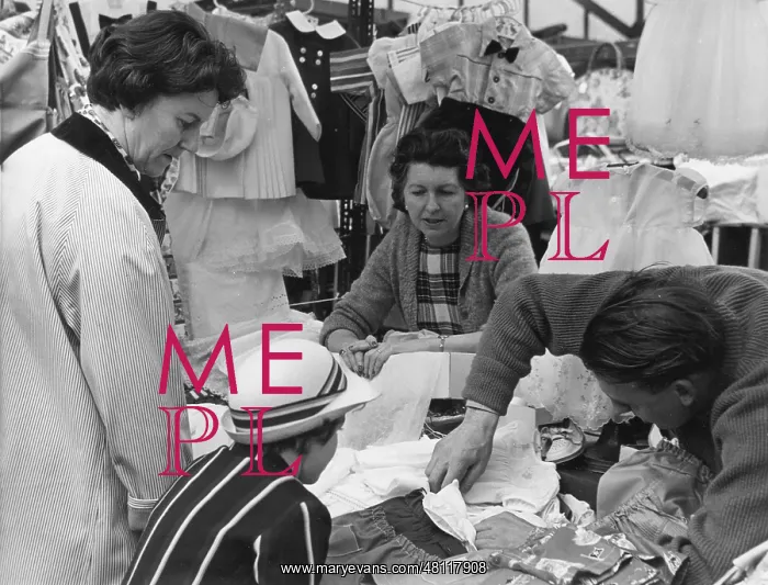 : People at a market stall : People at a market stall