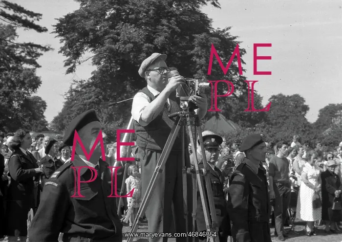 : People in a park, with cine camera : People in a park, with cine camera