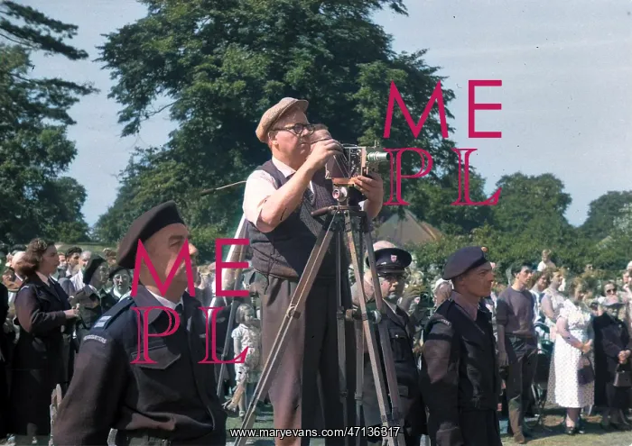  : People in a park, with cine camera