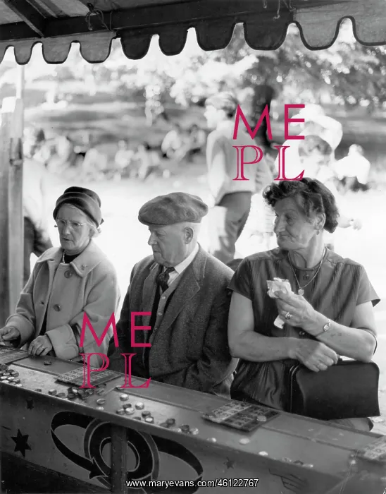 : People play bingo at a fairground stall : People play bingo at a fairground stall