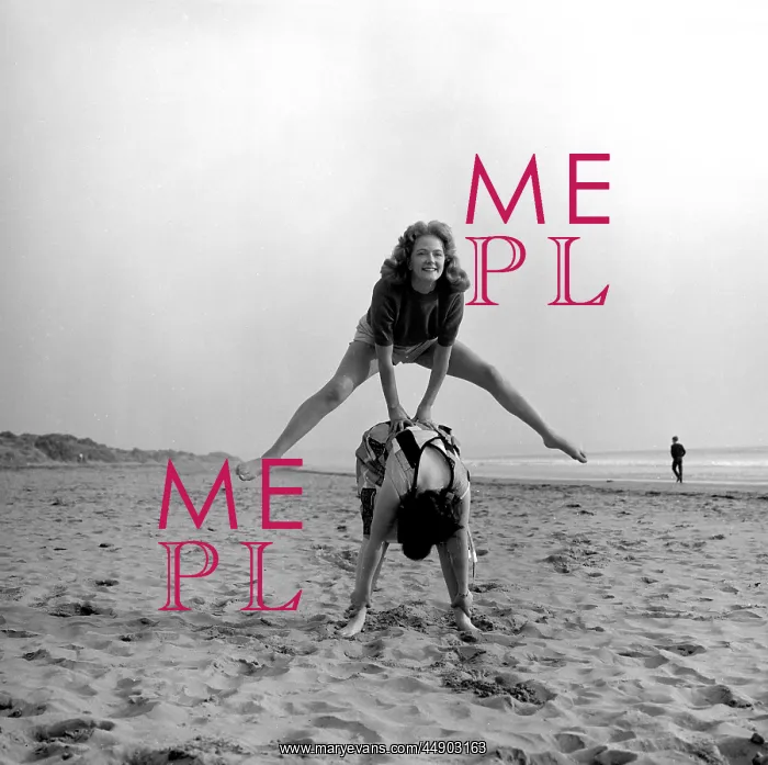 : Two people playing leapfrog on a beach : Two people playing leapfrog on a beach