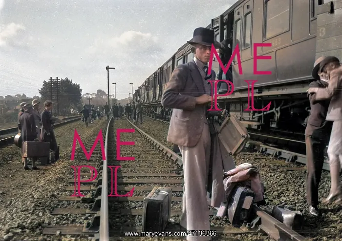 : People on a railway track alongside a train : People on a railway track alongside a train