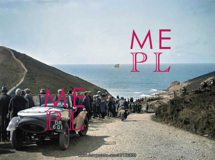 : People on road sloping down to the sea : People on road sloping down to the sea