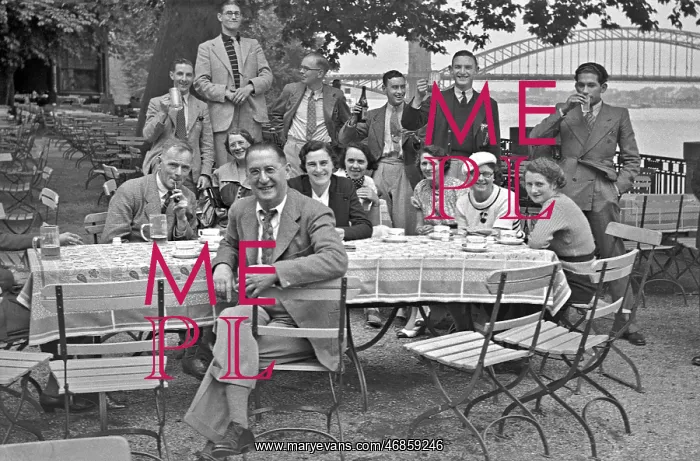 : People sitting at a table in the open air : People sitting at a table in the open air