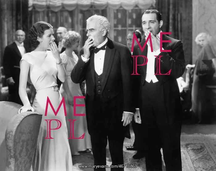 : Three people standing together at a formal party : Three people standing together at a formal party