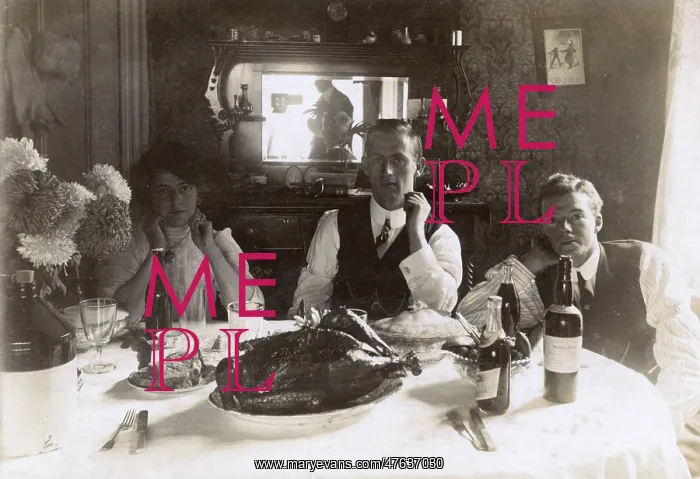 : Three people at a table, photographer reflected in mirror : Three people at a table, photographer reflected in mirror