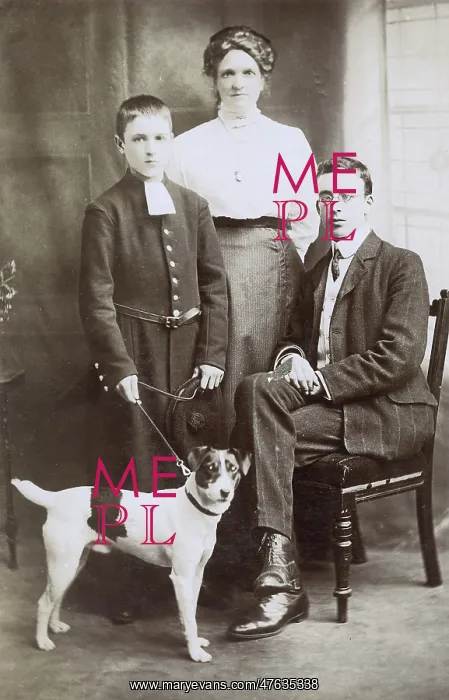  : Three people with terrier dog