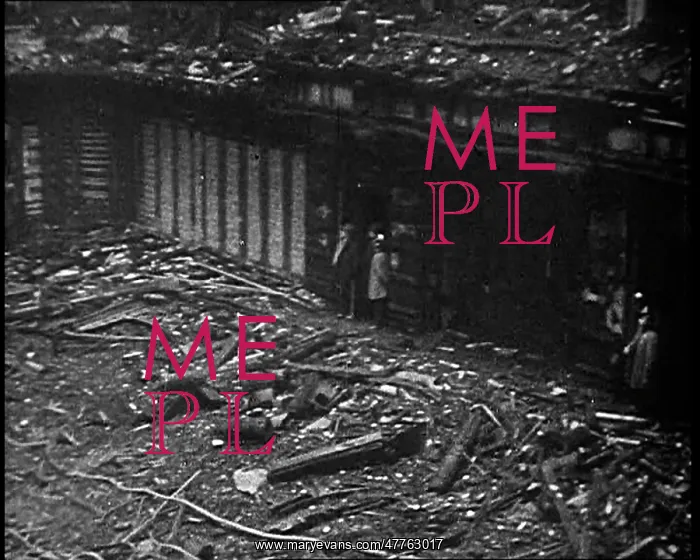 : People Walking Around a Burnt Out Building : People Walking Around a Burnt Out Building