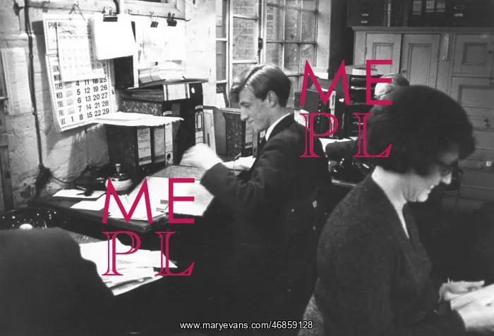 : Three people at work in an office : Three people at work in an office