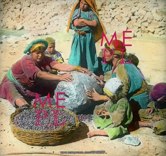  : Persian women using a large grindstone, Iran