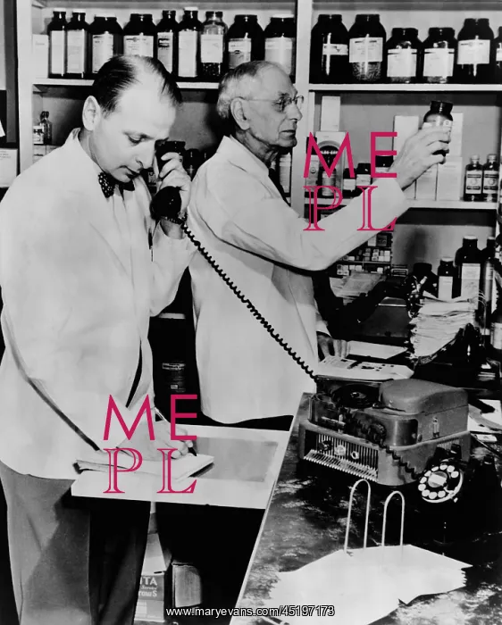 : A pharmacist demonstrates the use of an ? : A pharmacist demonstrates the use of an ?