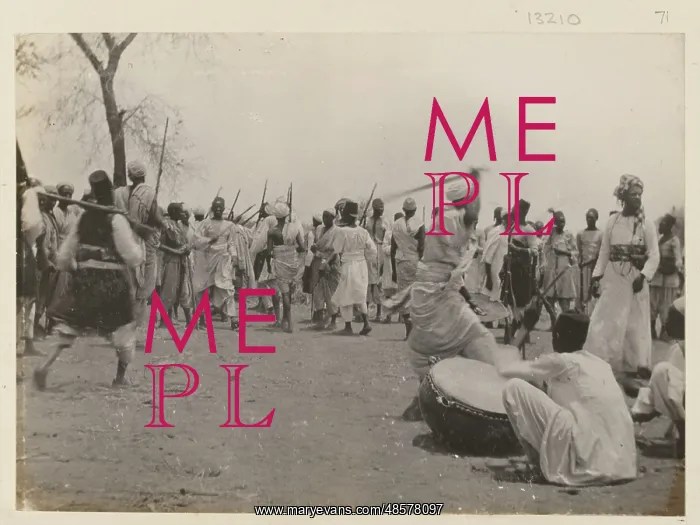 : Photograph of Sudanese preparing for battle : Photograph of Sudanese preparing for battle