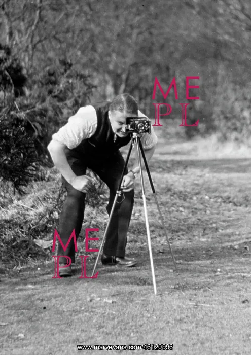 : Photographer with camera and tripod : Photographer with camera and tripod