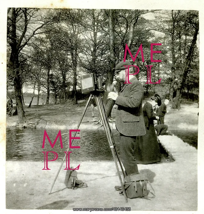  : Photographer with camera and tripod