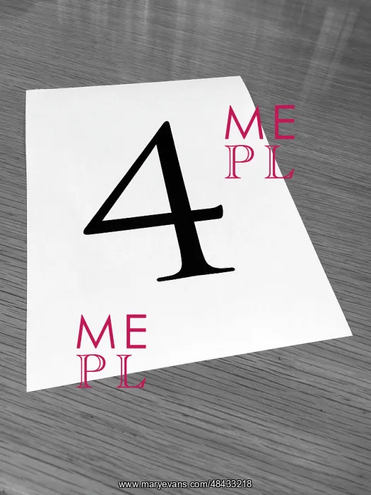: Piece of paper on a desk with a large number 4 : Piece of paper on a desk with a large number 4