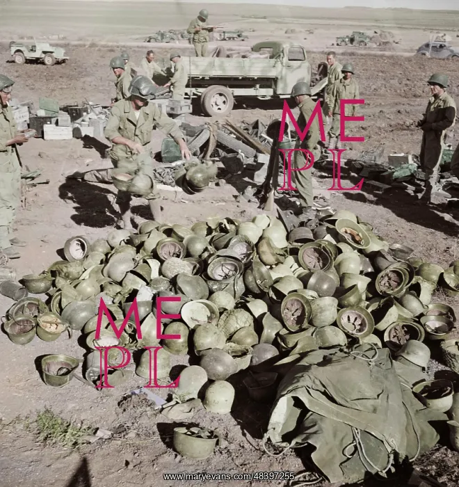 : Pile of German helmets left by the Tenth and : Pile of German helmets left by the Tenth and
