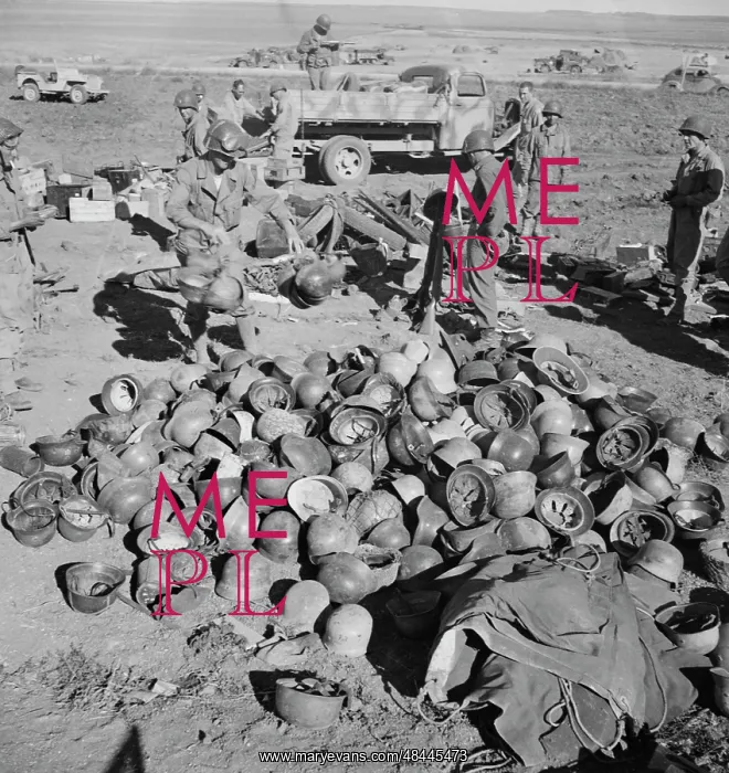 : Pile of German helmets left by the Tenth and : Pile of German helmets left by the Tenth and