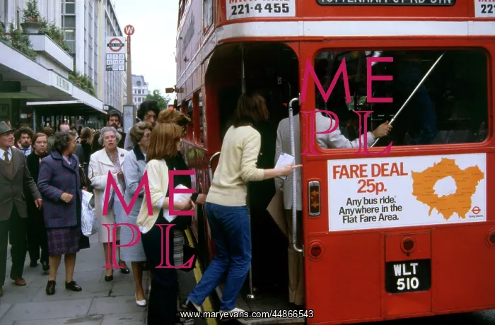 : PILING ONTO A LONDON BUS : PILING ONTO A LONDON BUS