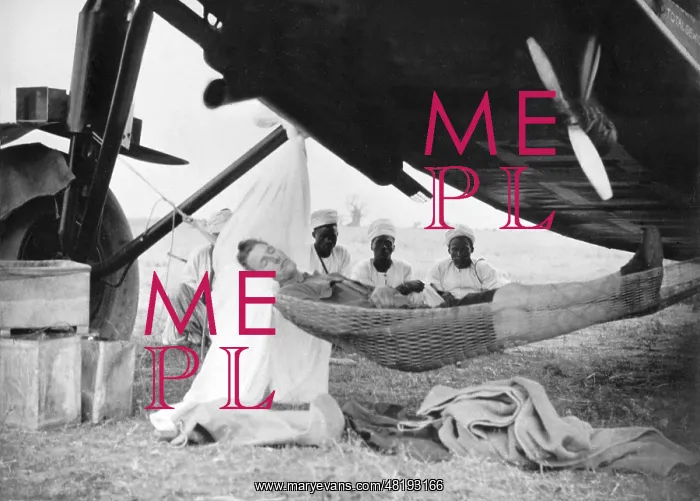 : Pilot falls asleep under his plane in Africa, 1929 : Pilot falls asleep under his plane in Africa, 1929