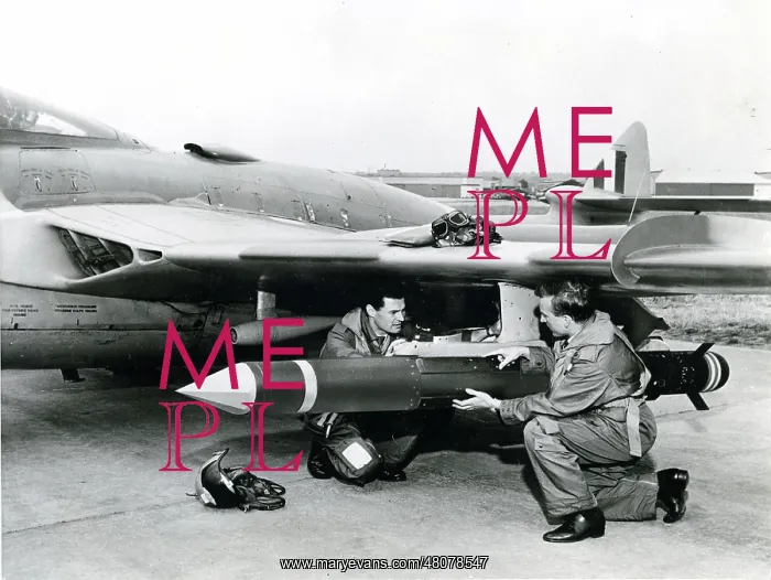 : The pilot and navigator carry out final checks of a de : The pilot and navigator carry out final checks of a de