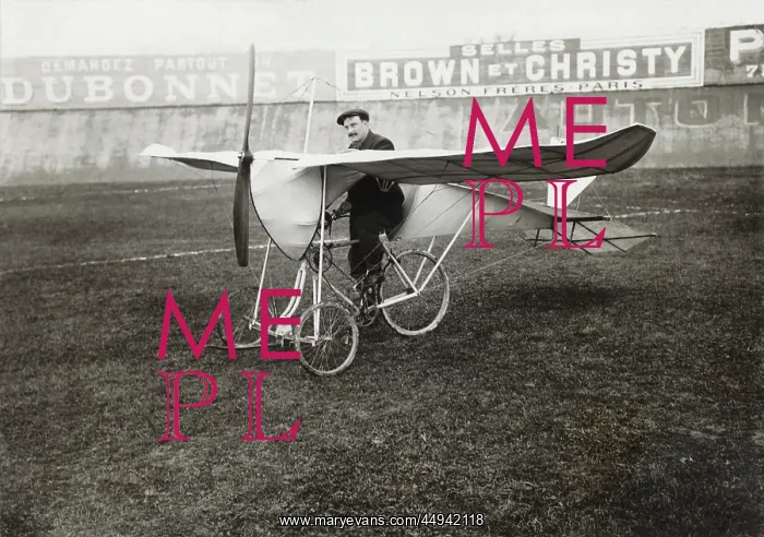 : Pilot Sitting on Bi-Cycle Aircraft with Adverts in the ? : Pilot Sitting on Bi-Cycle Aircraft with Adverts in the ?