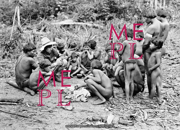 : A pilot surrounded by Amazon Indians, 1934 : A pilot surrounded by Amazon Indians, 1934