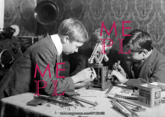  : Playing with Meccano, possibly 1920s