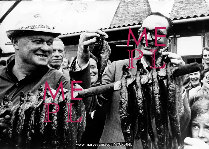 : PM Jacques Chirac with herring in Copenhagen, Denmark : PM Jacques Chirac with herring in Copenhagen, Denmark