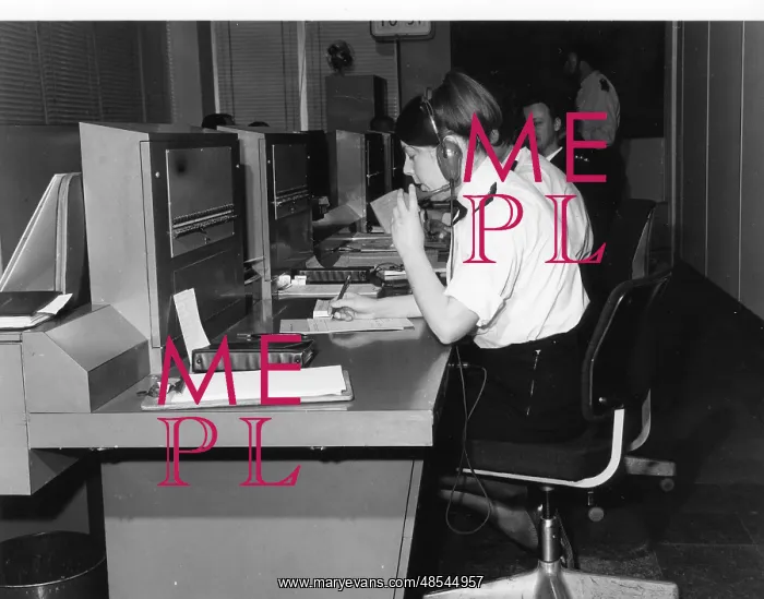 : Police officers at work in communications room : Police officers at work in communications room