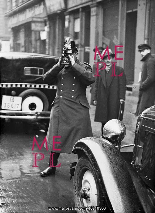 : Police official with a camera, 1932 : Police official with a camera, 1932