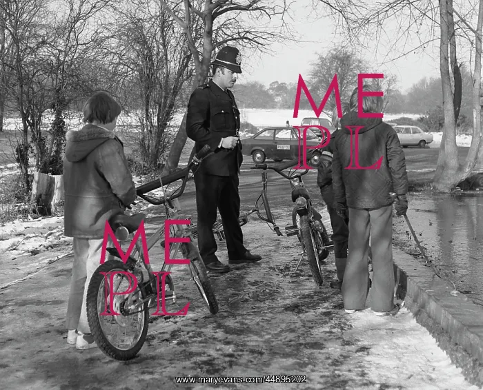 : Policeman with three boys and their bicycles : Policeman with three boys and their bicycles