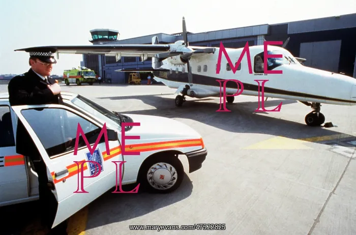 : Policeman, car and light aircraft : Policeman, car and light aircraft