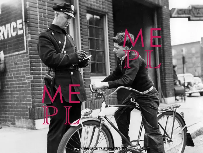 : Policeman controls a cyclist in America, 1938 : Policeman controls a cyclist in America, 1938