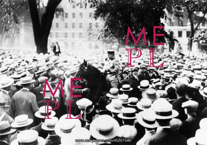 : Policeman drives his horse through the crowds on : Policeman drives his horse through the crowds on