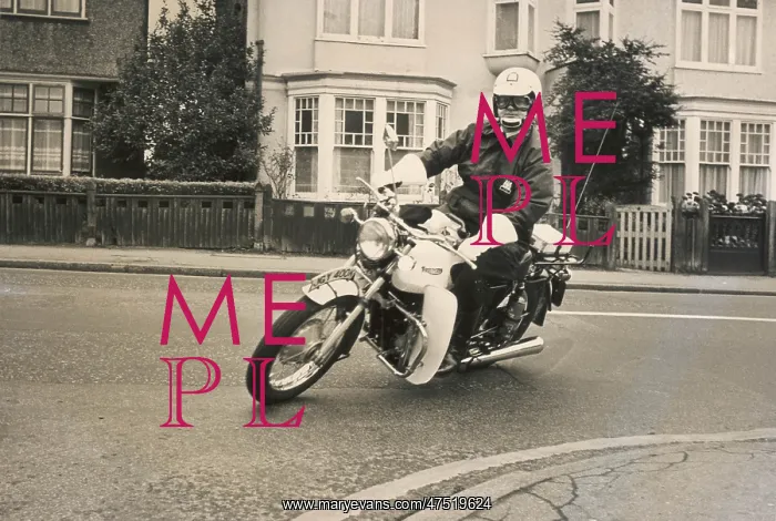 : Policeman riding a Triumph motorcyle : Policeman riding a Triumph motorcyle