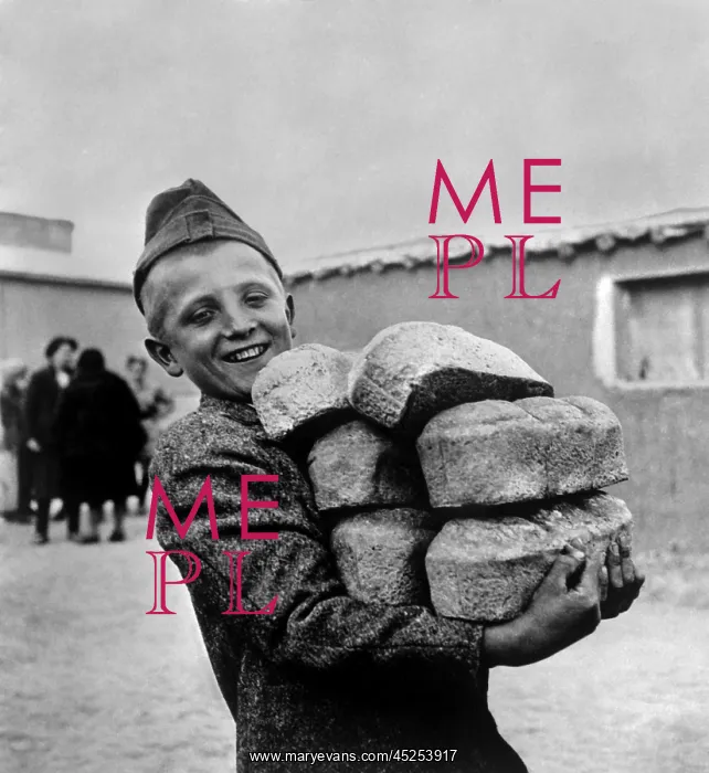 : Polish youngster with bread made from flour supplied : Polish youngster with bread made from flour supplied