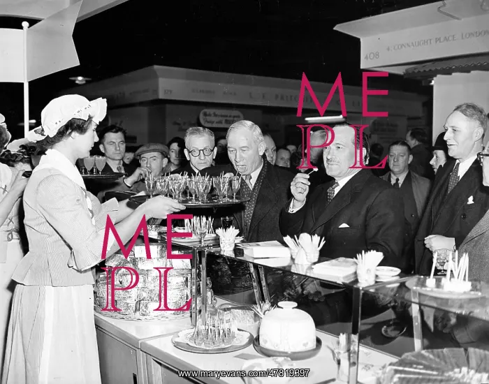 : Politicians and dignitaries enjoying the samples at a food e : Politicians and dignitaries enjoying the samples at a food e