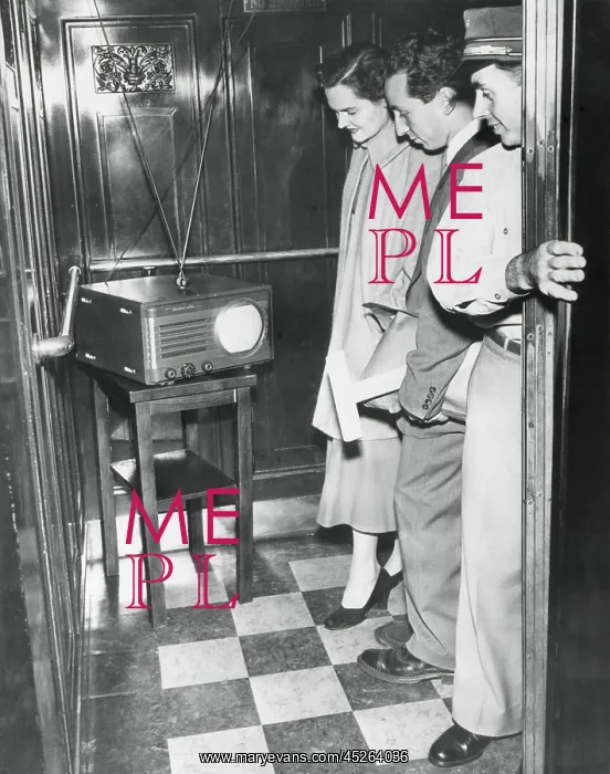 : Portable television in a New York City elevator : Portable television in a New York City elevator