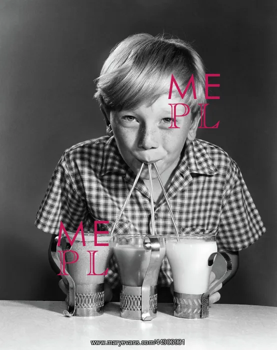 : Portrait of blonde boy drinking with straws from : Portrait of blonde boy drinking with straws from