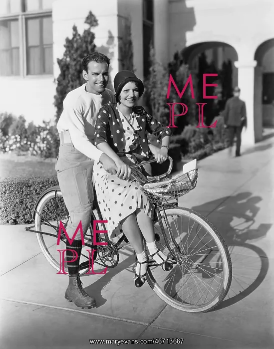 : Portrait of couple on bicycle together : Portrait of couple on bicycle together