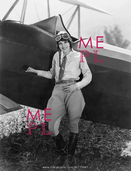 : Portrait of female aviator with plane : Portrait of female aviator with plane