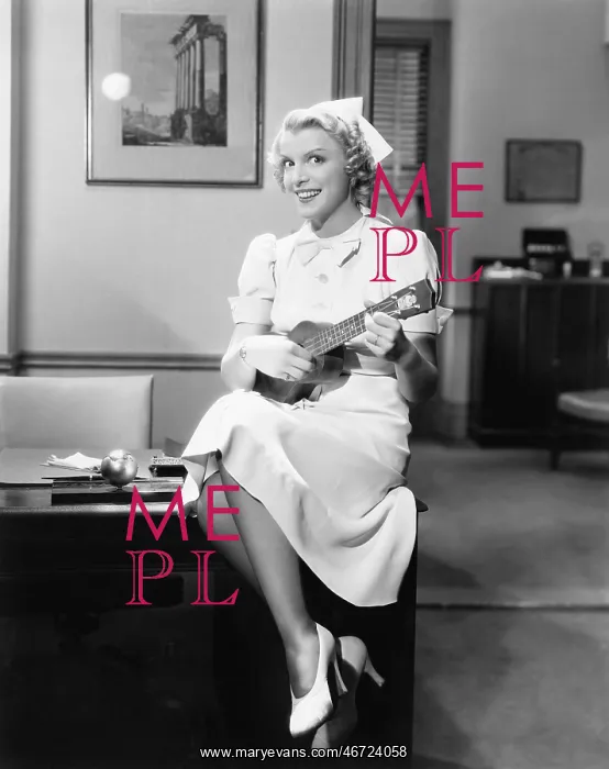: Portrait of a female nurse sitting on a table and : Portrait of a female nurse sitting on a table and