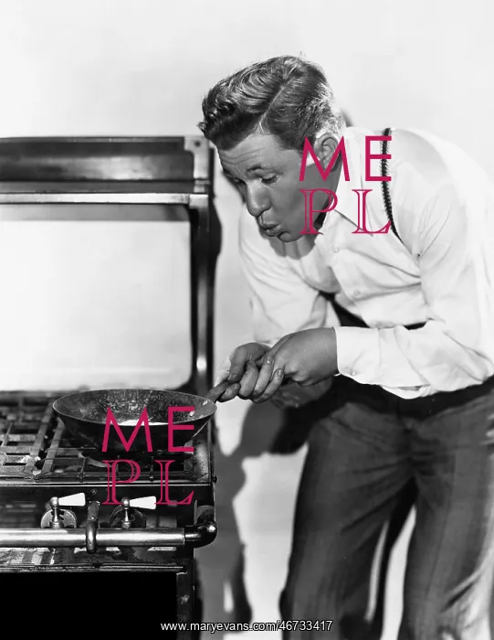: Portrait of man cooking on stove : Portrait of man cooking on stove